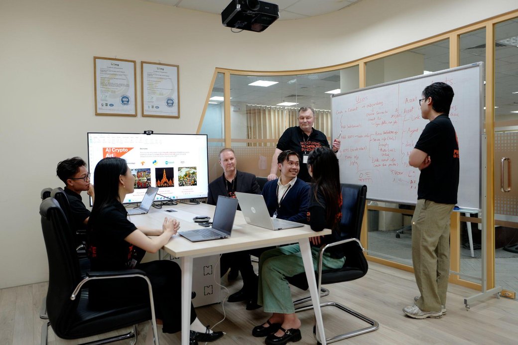 PowerGate Software team collaborating on an AI agent workflow project in their office