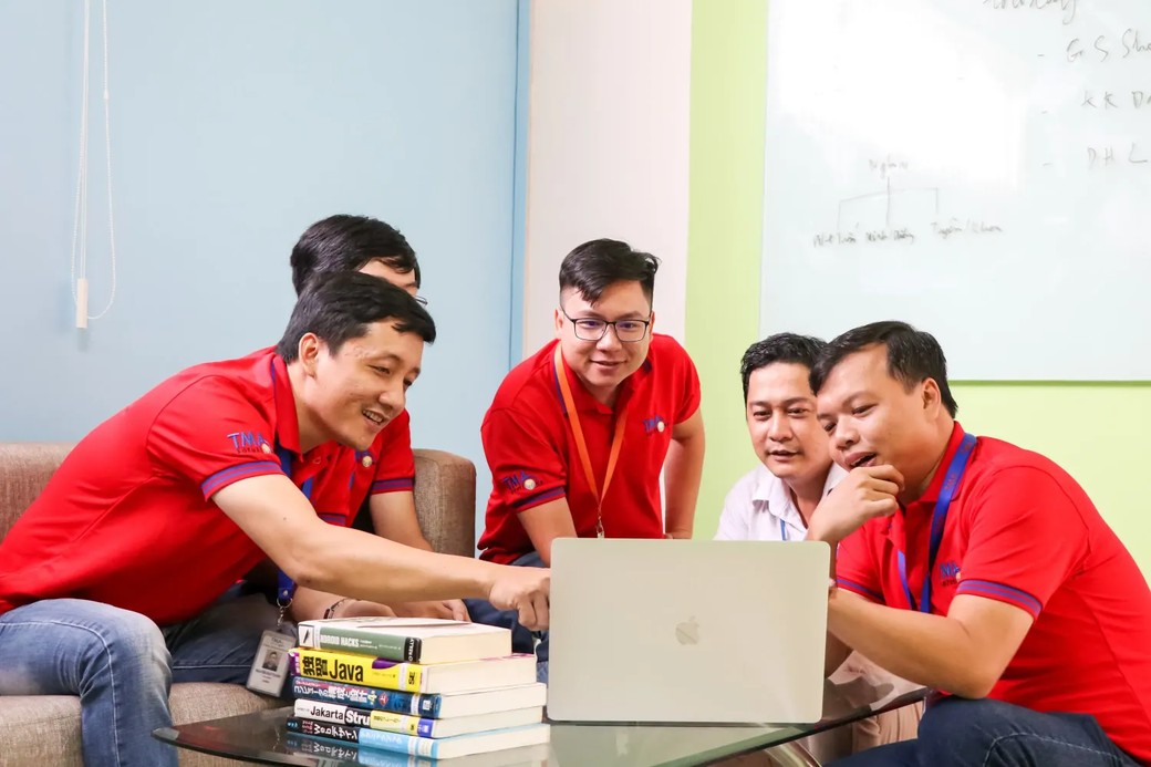 TMA Solutions team working on enterprise AI and software development